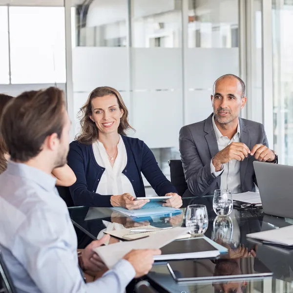 Two men and a woman in a business meeting