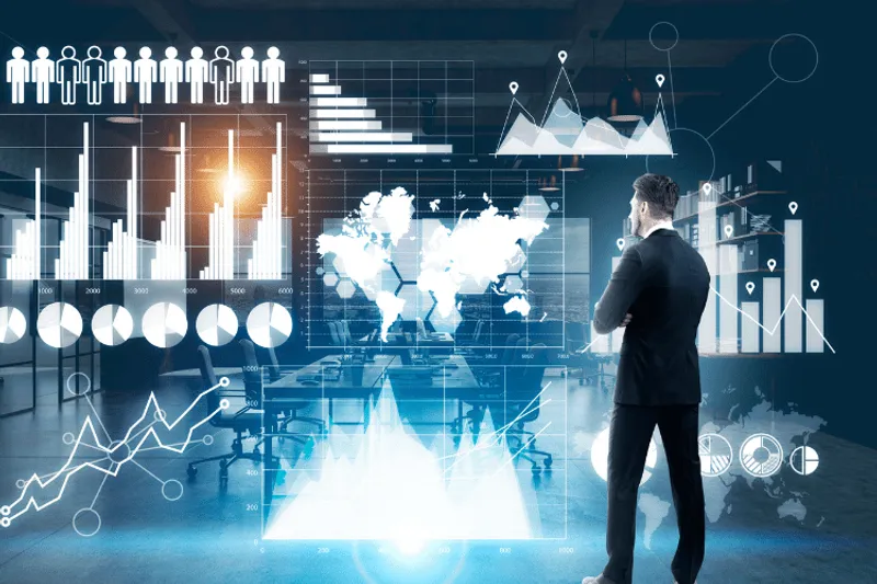Businessman analysing virtual economic charts and graphs