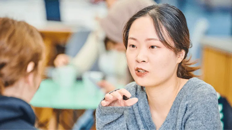 An Asian student chatting